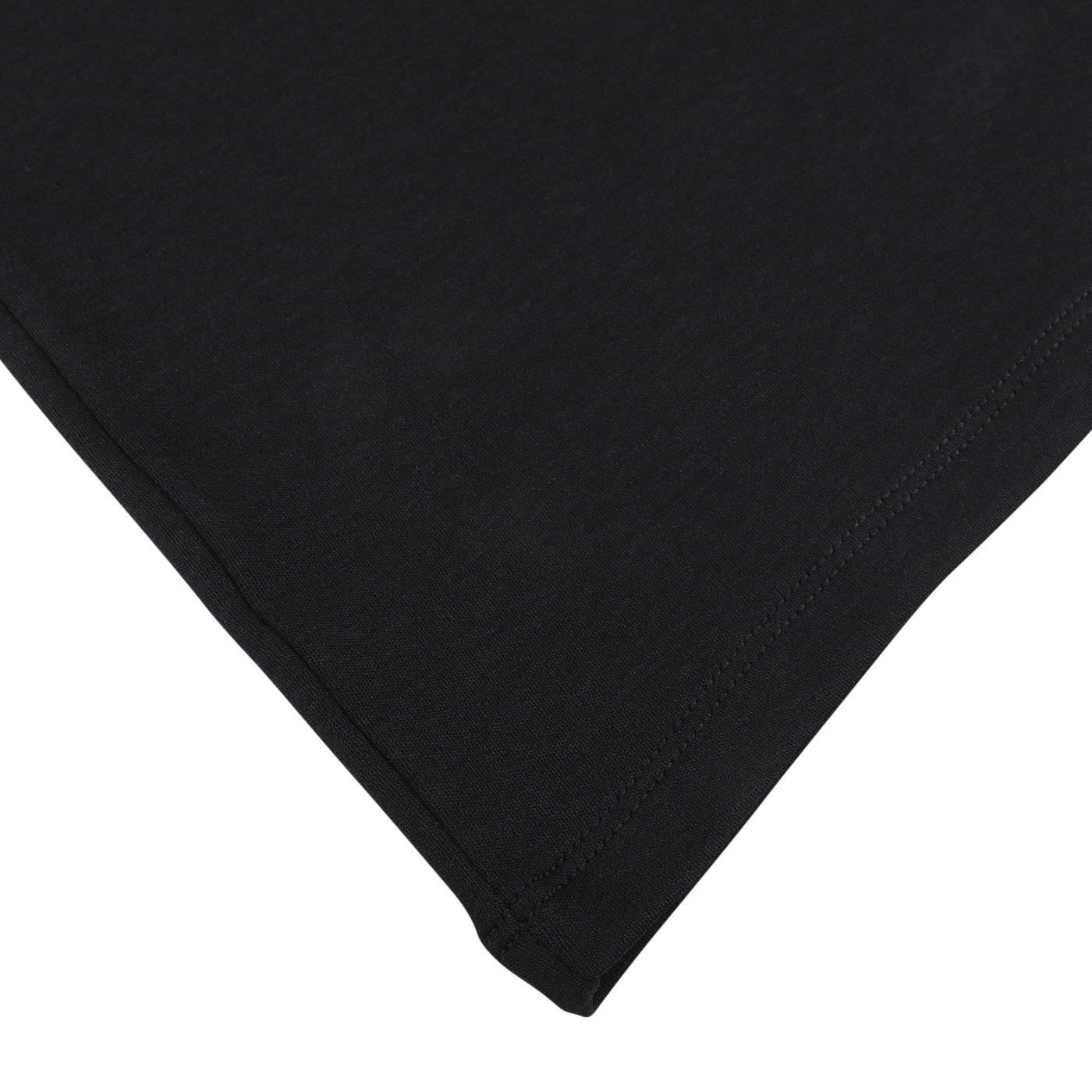 Close-up of the edge of a black fabric, showing details of the stitching and hem, characteristic of The White Briefs' classic Black Pima Cotton Earth T-Shirt made from organic pima cotton.