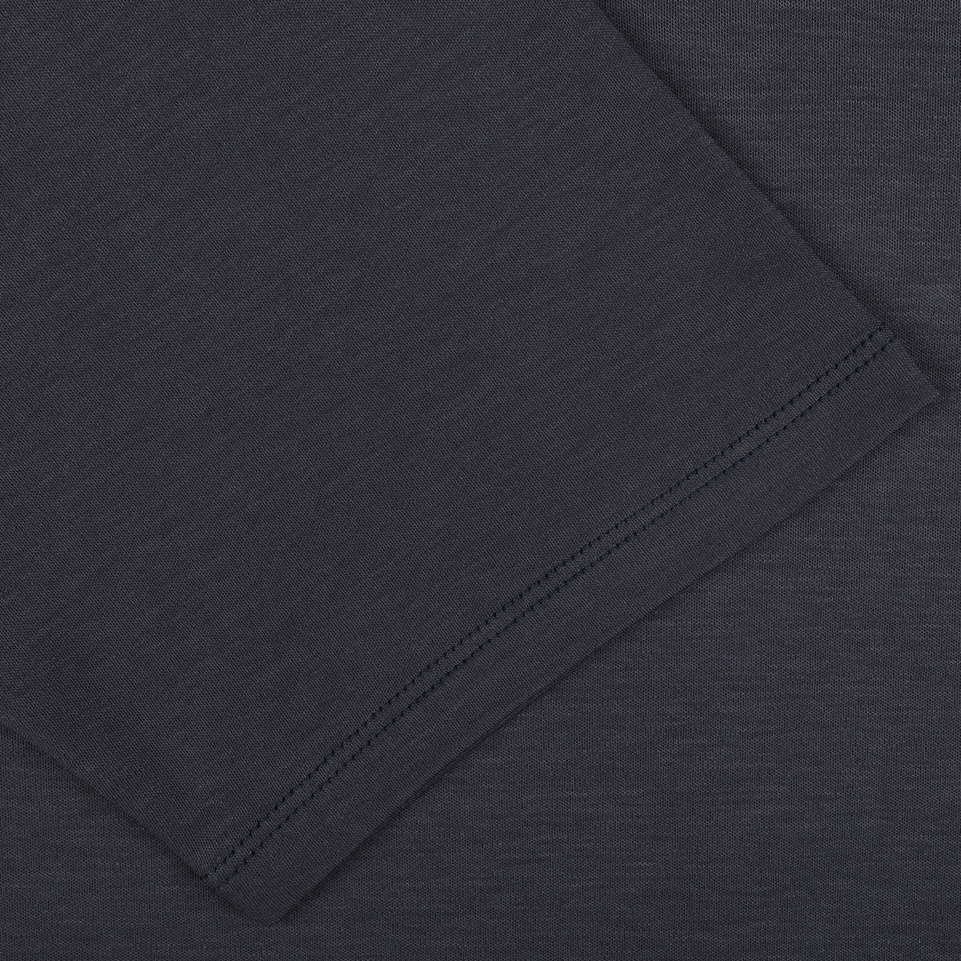 Close-up view of the dark gray fabric with visible stitching along the edge, perfect for The White Briefs' Parisian Night Pima Cotton Earth T-Shirt.