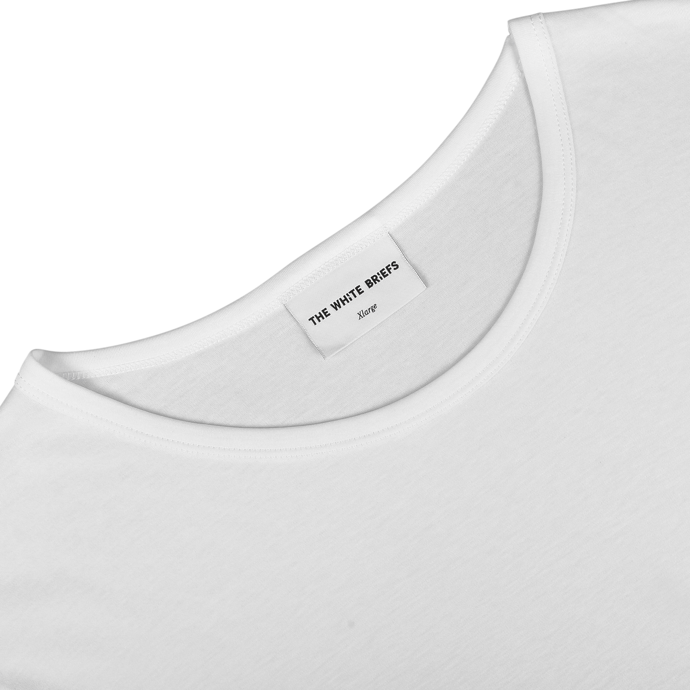 Close-up of a slim fit, white crewneck T-shirt neckline featuring a "The White Briefs Medium" label, made from organic pima cotton, known as the White Pima Cotton Earth T-Shirt.