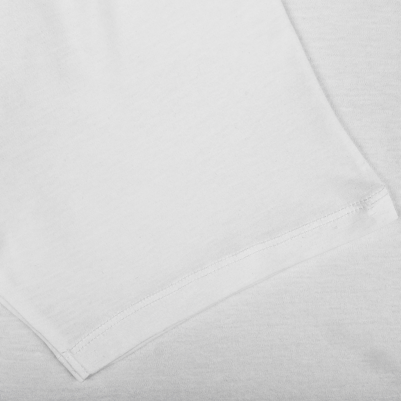 A White Pima Cotton Earth T-Shirt by The White Briefs, known for its white slim fit and made from organic pima cotton, lies on a pristine white surface.