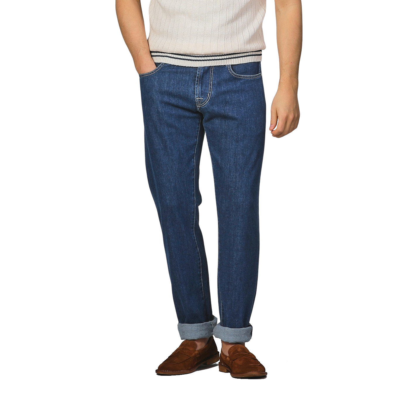 Wearing a white ribbed shirt, slim fit Tramarossa Blue Sky Relax Super Stretch Michelangelo jeans with cuffs, and brown shoes, a person stands against a plain background.