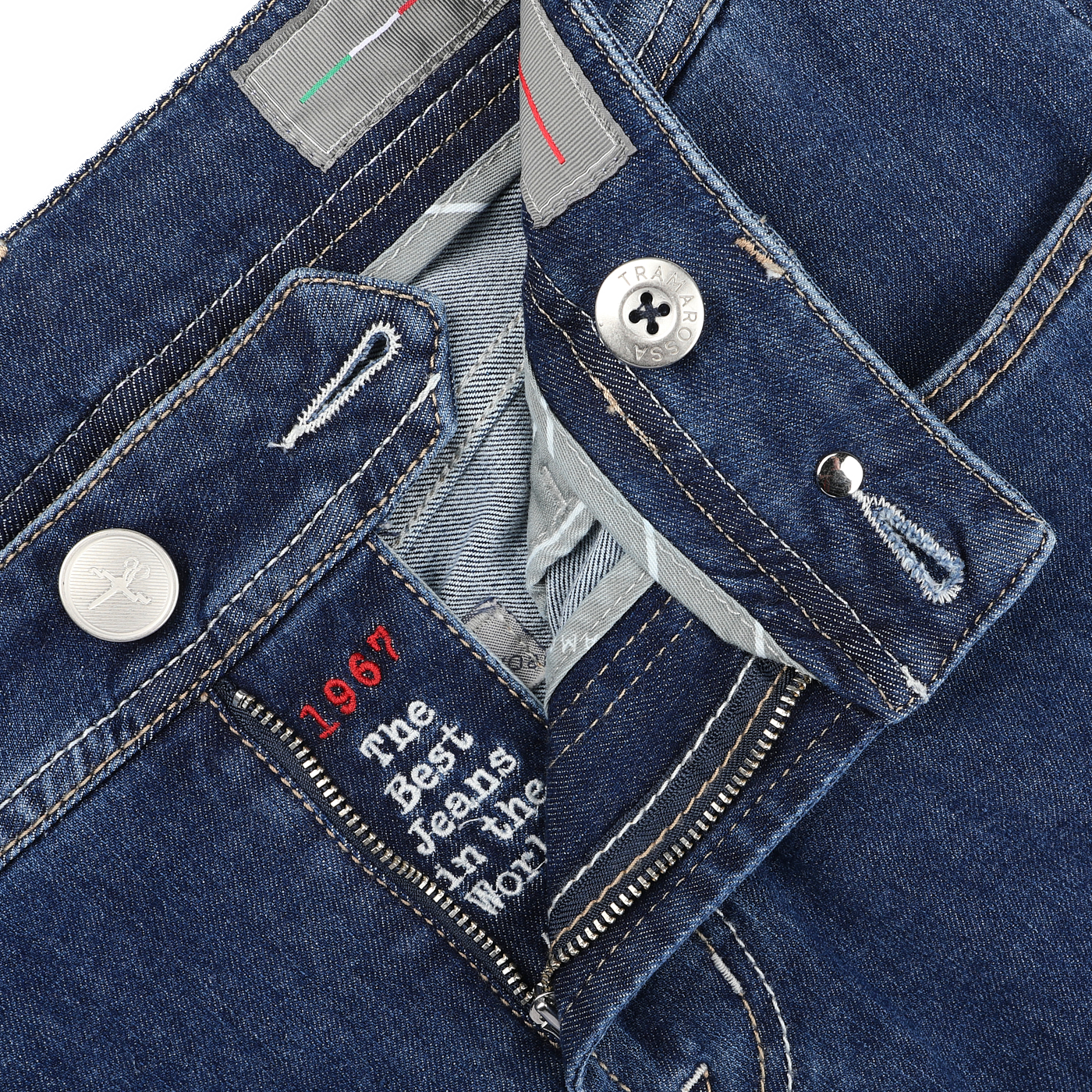 Close-up of Tramarossa's Blue Sky Relax Super Stretch Michelangelo Jeans in dark blue denim, featuring a visible button and zipper. The inside label reads "The Best Jeans in the World, 1967." Designed for ultimate style and ease, these jeans offer a comfortable slim fit.