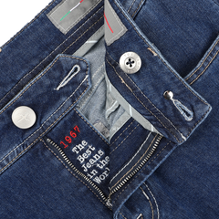 Close-up of Tramarossa's Blue Sky Relax Super Stretch Michelangelo Jeans in dark blue denim, featuring a visible button and zipper. The inside label reads "The Best Jeans in the World, 1967." Designed for ultimate style and ease, these jeans offer a comfortable slim fit.