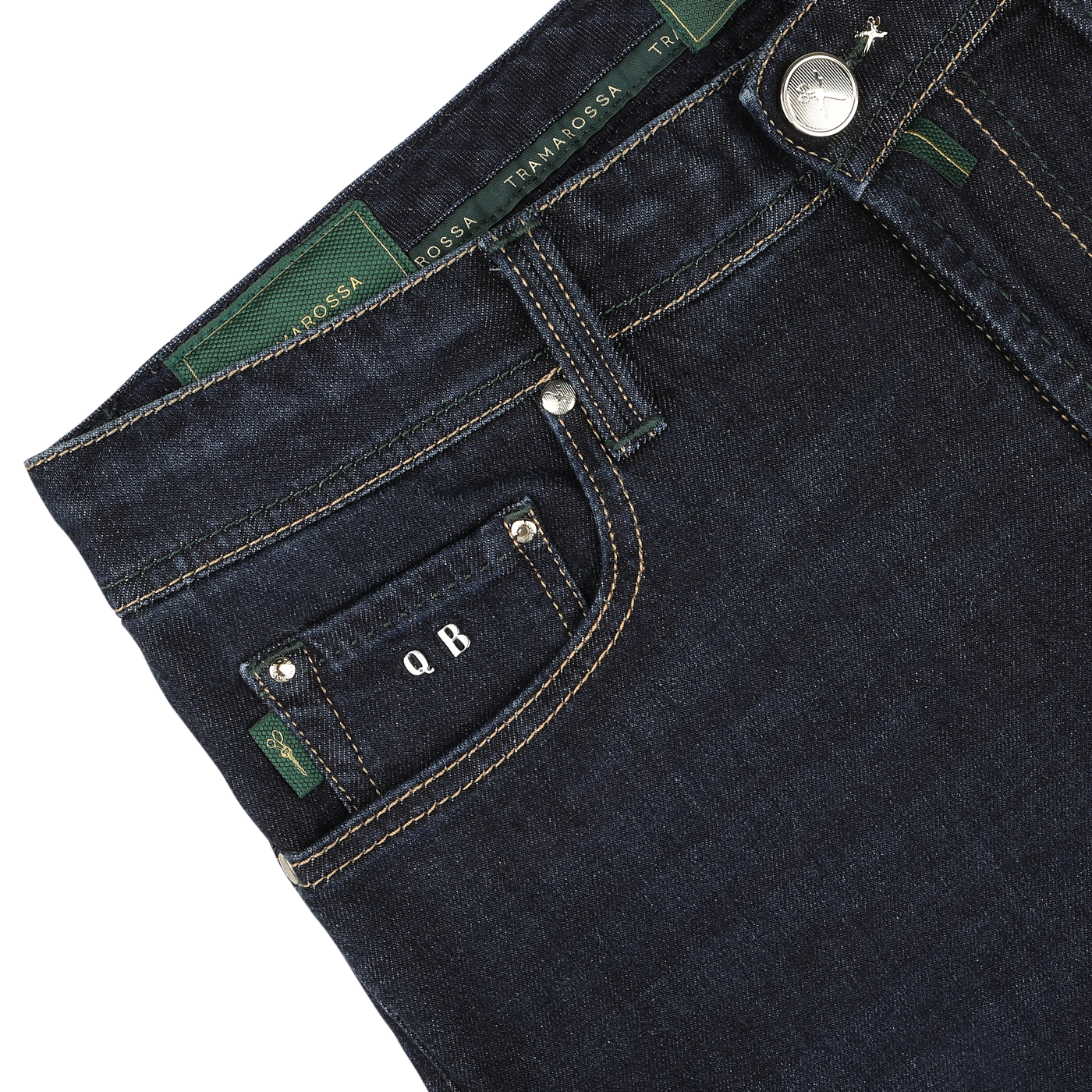 Close-up of the waistband and front pocket of Tramarossa's Dark Blue Cotton Cashmere Michelangelo Jeans, featuring green stitching and custom initials "Q B" on a black tag, showcasing comfort stretch denim for ultimate wearability.