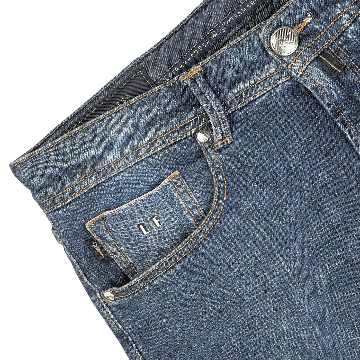 Close-up image of Washed Blue Loro Piana Cotton Michelangelo Jeans from Tramarossa, featuring a small front pocket with visible stitching, button detail, and a label inside the pocket with the initials "LF." The comfort stretch denim ensures a perfect blend of style and flexibility.