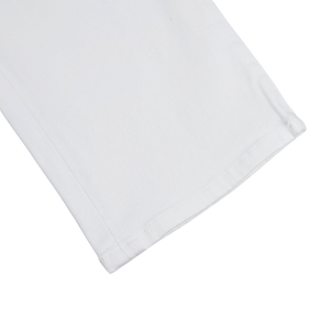 A White Super Stretch Michelangelo Jeans by Tramarossa on a comfortable white surface.
