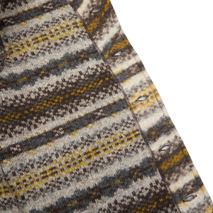 A close up of a Brown Fair Isle Wool New York Button Cardigan made with boiled merino wool mix by Universal Works.