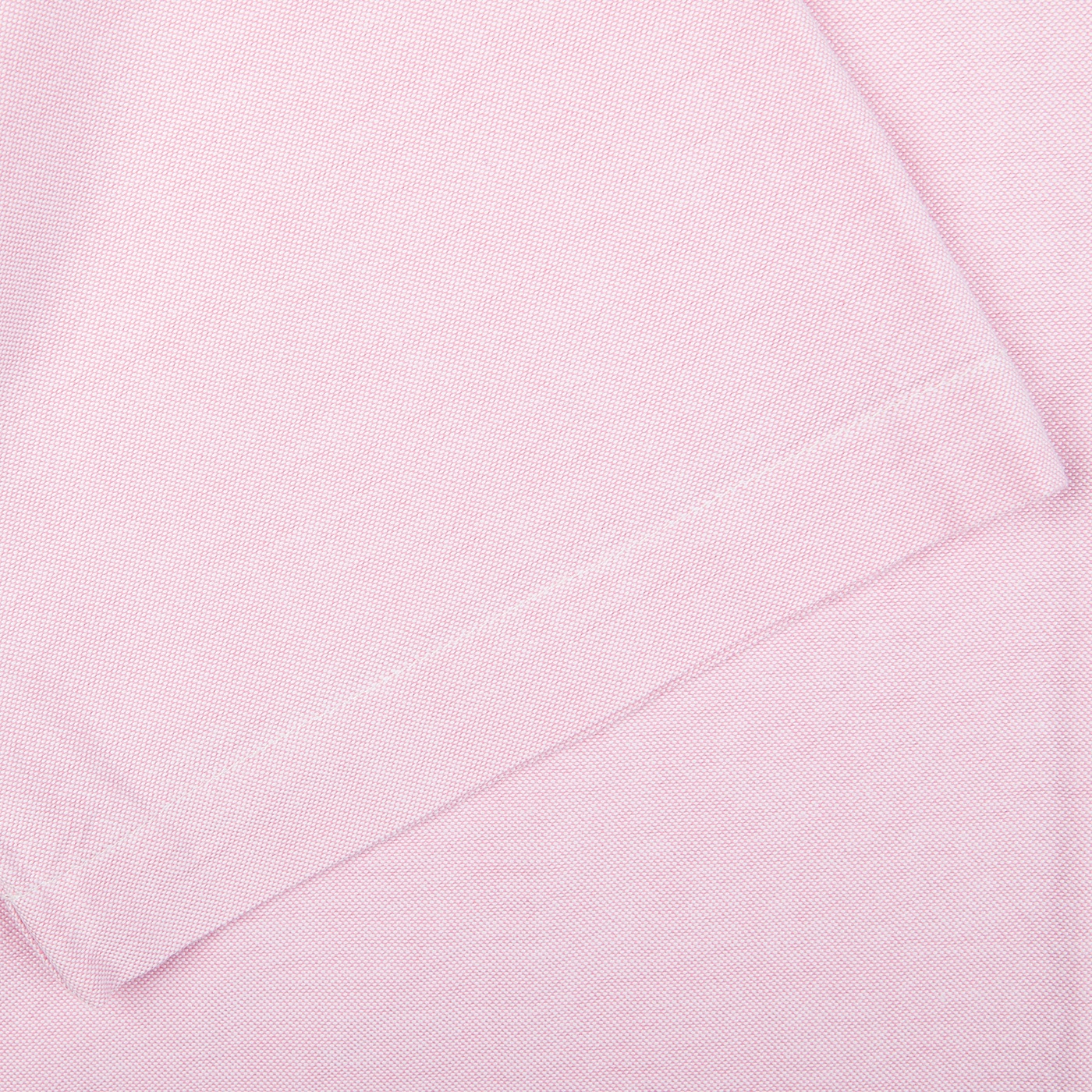 A close up of a Universal Works Pink Cotton Oxford Camp Collar Road Shirt.