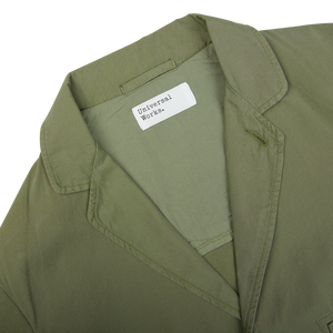 Birch Green Cotton Summer Canvas 5-Pocket Jacket with a label showing the brand "Universal Works".