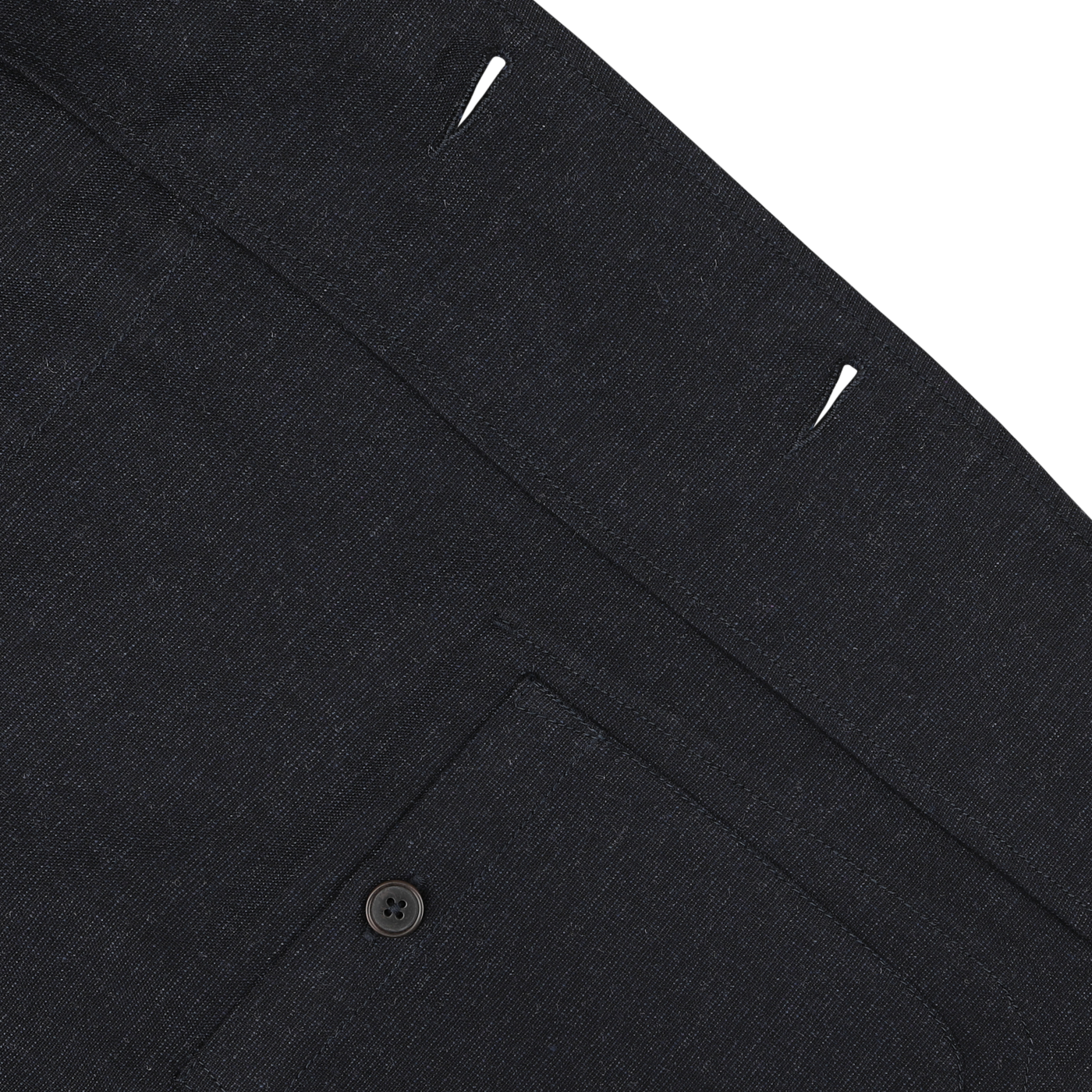 Close-up of the Navy Blue Birdseye Tweed 3 Button Jacket by Universal Works, highlighting a back pocket with a button, looped stitches, and a thick seam.