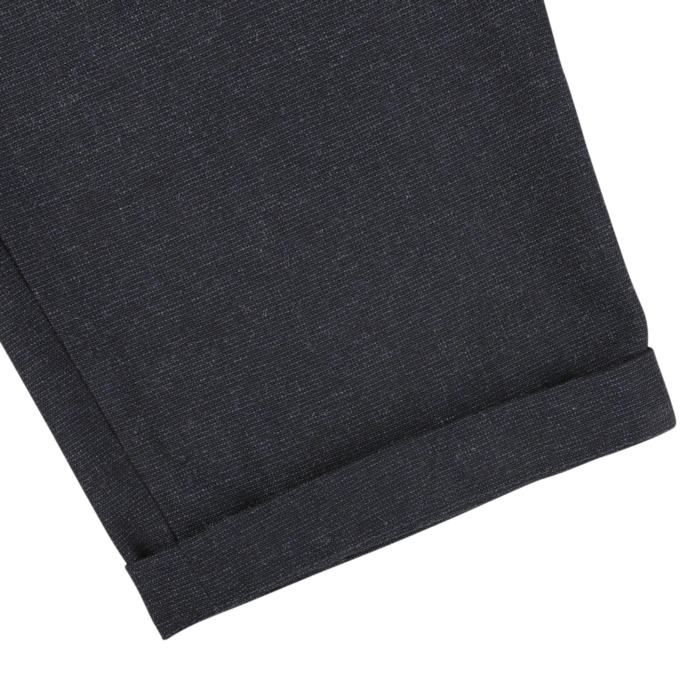 Close-up image of a navy blue fabric with a rolled hem, likely part of Universal Works Navy Blue Birdseye Tweed Military Chinos.