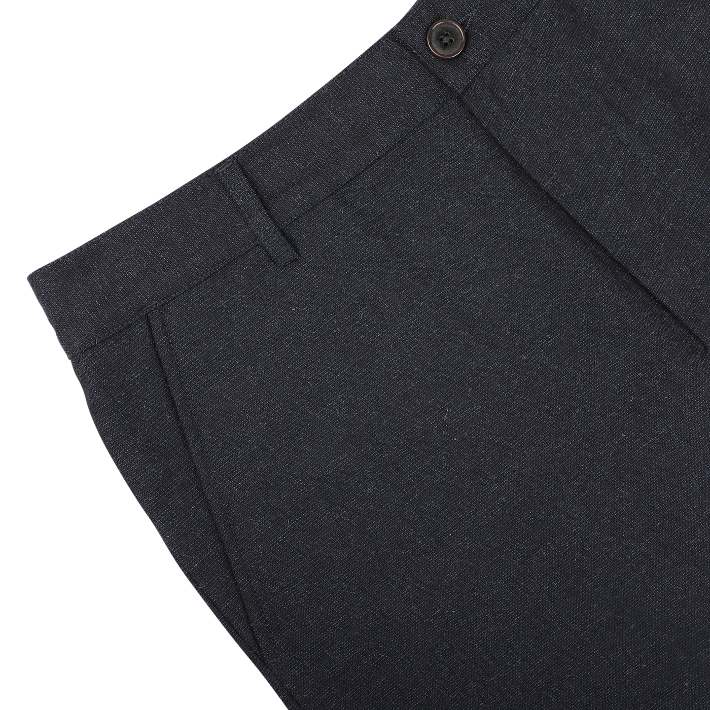 A close-up view of the upper section of navy blue Birdseye tweed military chinos from Universal Works, featuring a button and belt loop, crafted from upcycled wool tweed.