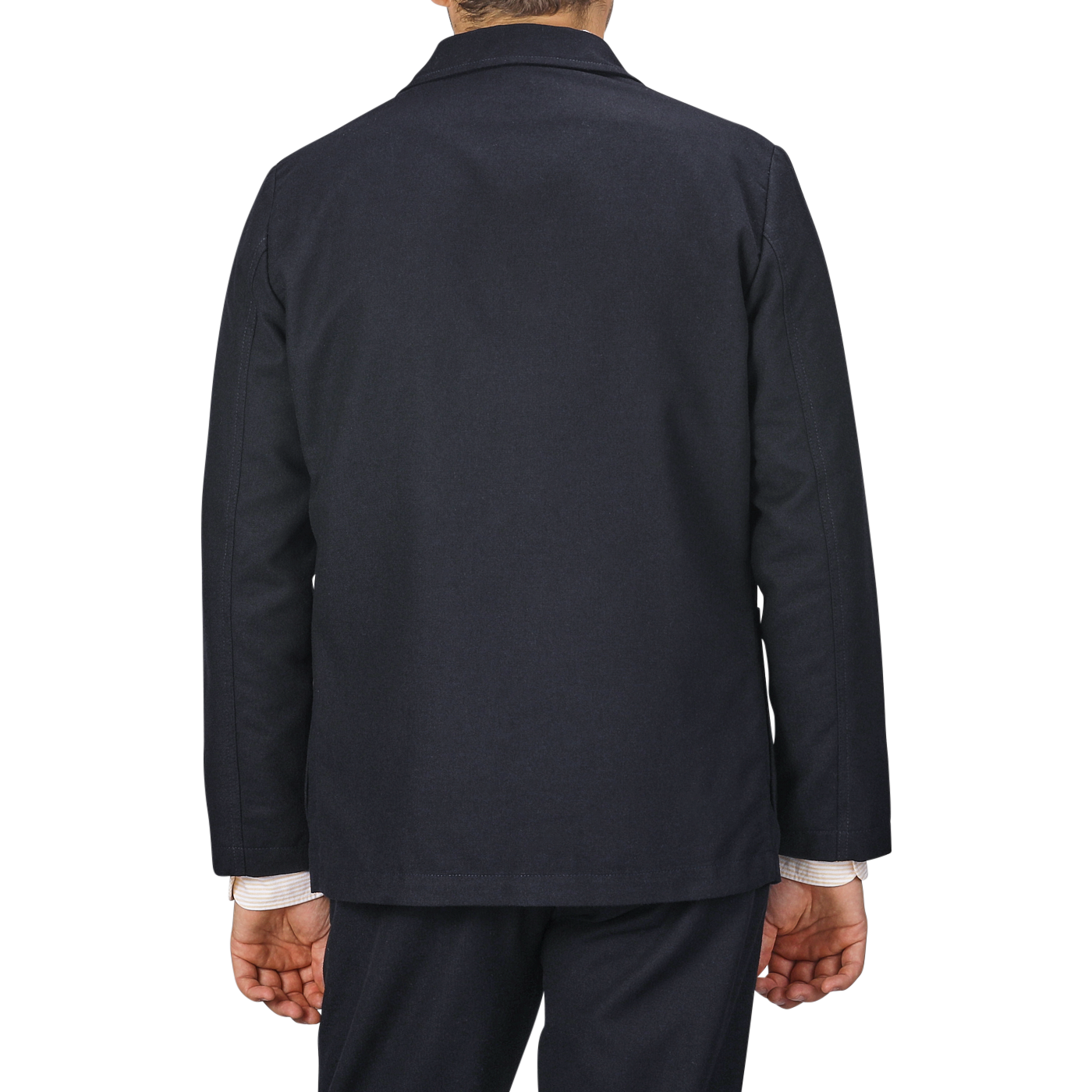 Back view of a person wearing a contemporary **Navy Blue Upcycled Tweed 2 Button Jacket** by **Universal Works** over a light-colored shirt, standing against a gray background.