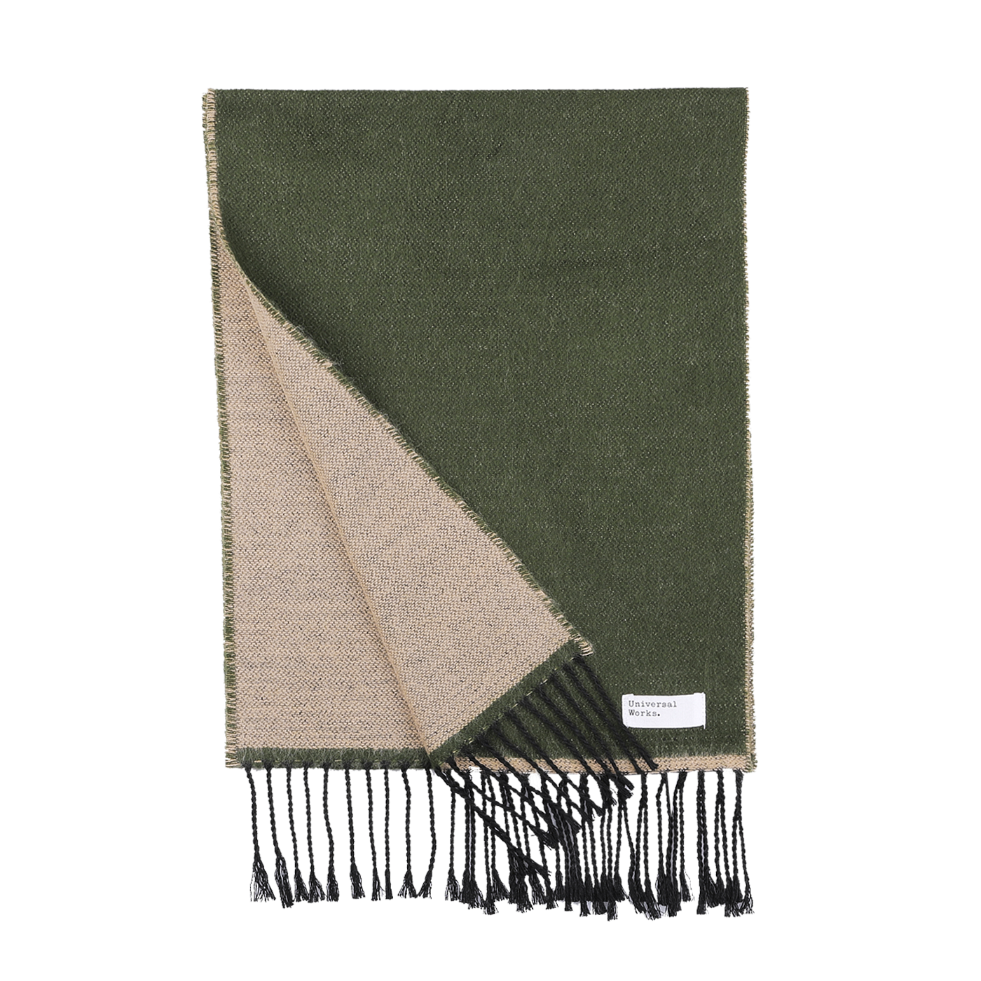 An olive-green and beige, double-sided seasonal scarf with black fringed ends, partially folded to reveal both sides. A small white label on the scarf reads "Universal Works." Made in Italy, this stylish accessory adds a touch of elegance to your winter wardrobe and is known as the Grass Beige Double-Sided Acrylic Scarf.