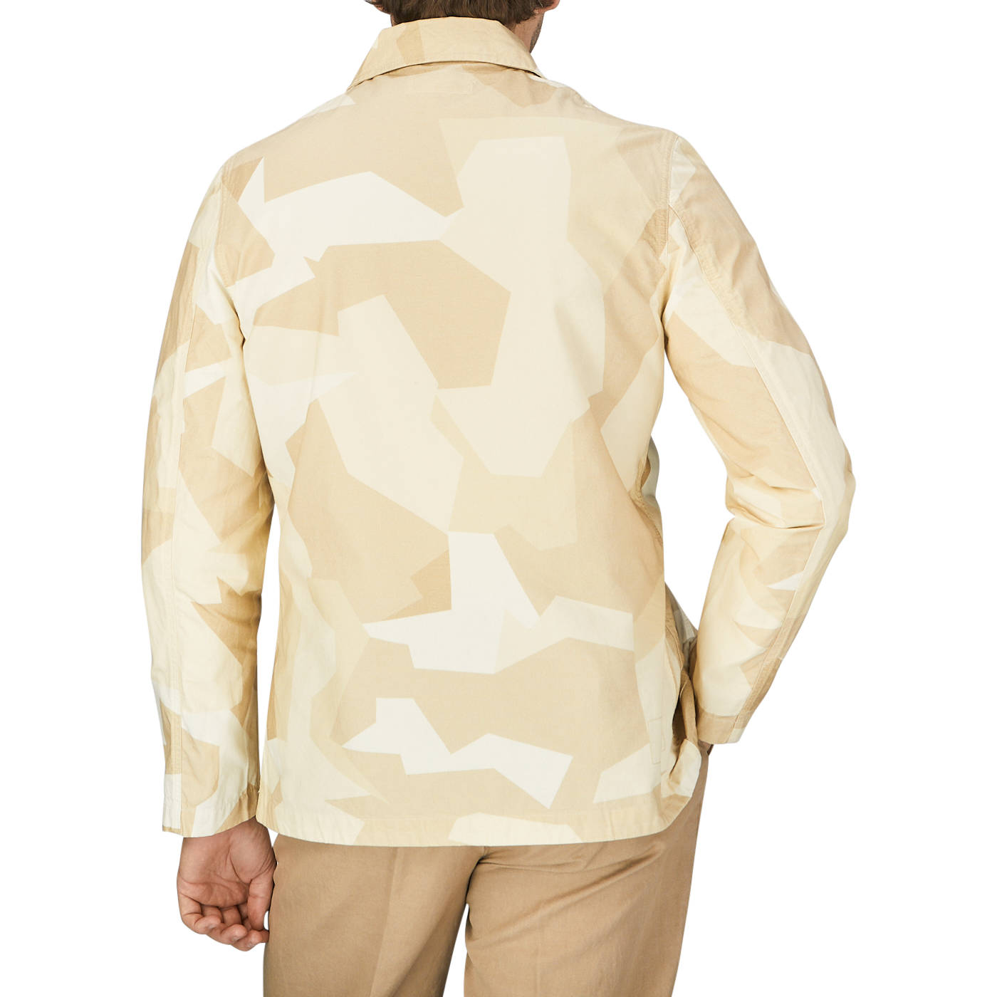 The back view of a man wearing a Universal Works Sand Beige Camo Cotton Bakers C jacket.
