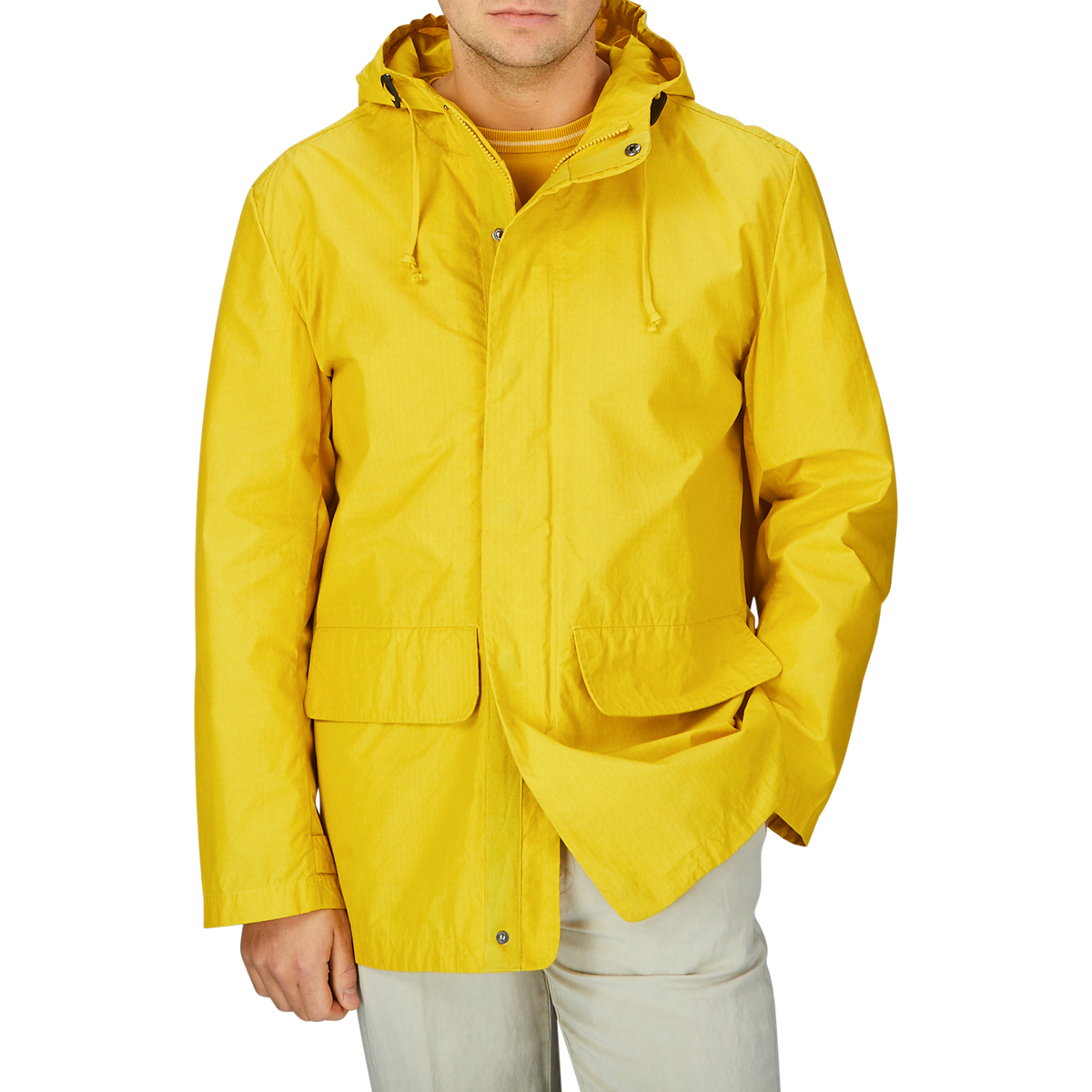 A man wearing a Universal Works Yellow Cotton Ripstop Stanedge Jacket.
