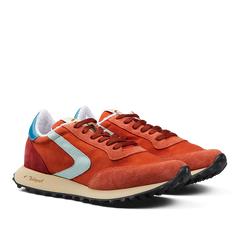 A pair of Valsport Bright Orange Nylon Suede Heritage sneakers with light blue accents and beige soles.