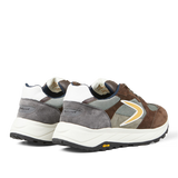 A pair of Valsport Dark Brown Leather Nylon Vibram sneakers with a chunky Vibram sole design featuring mixed materials and branding on the side.