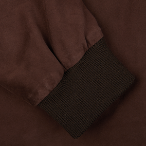 Close-up of a dark brown suede leather Valstarino jacket from Valstar with a ribbed cuff detail.