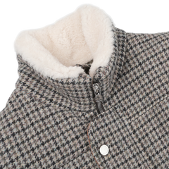 Close-up of the Valstar Green Houndstooth Wool Tweed Padded Gilet with a cozy, white shearling collar. The gilet features a zipper and snap button closure.