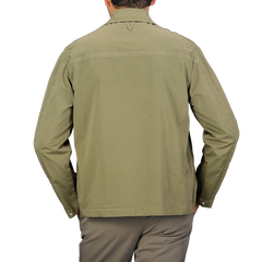 A person wearing a Valstar Green Soft Cotton Nylon Coach Jacket and brown pants is facing away from the camera against a gray background.