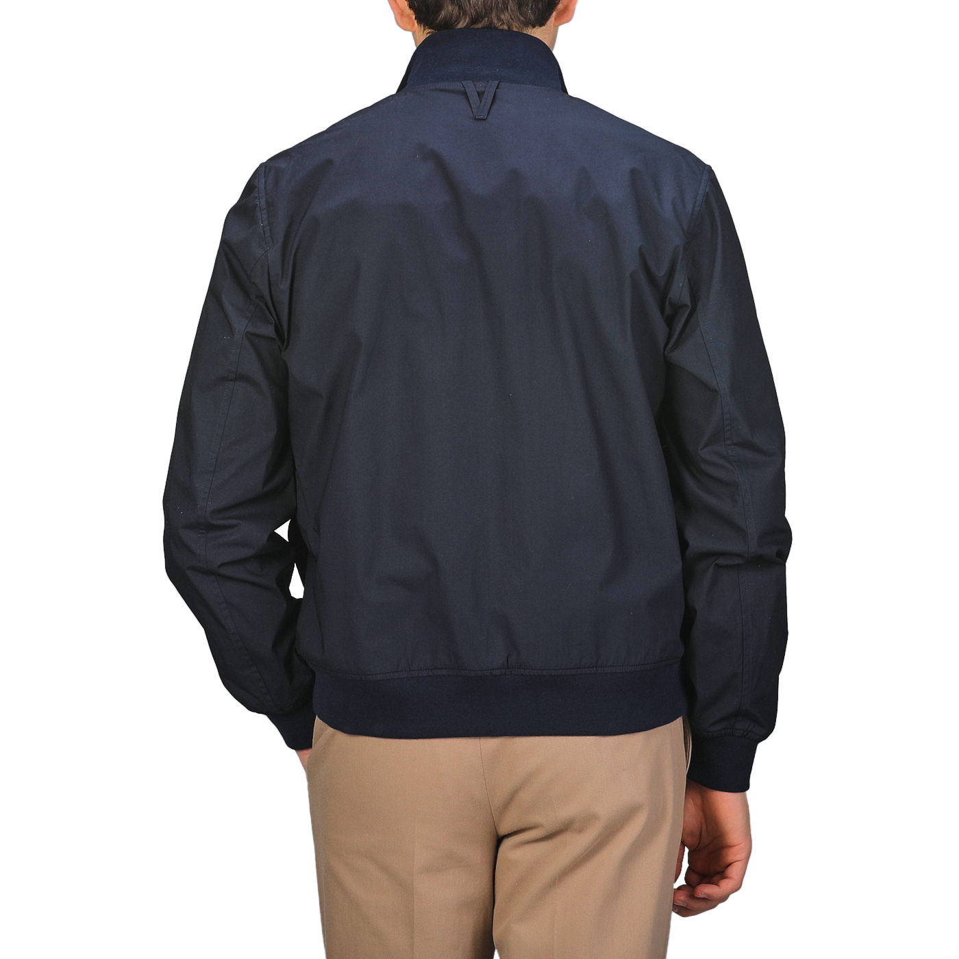 A person wearing a Valstar Navy Blue Cotton Poplin Valstarino Jacket and beige pants, seen from the back.