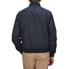 A person wearing a Valstar Navy Blue Cotton Poplin Valstarino Jacket and beige pants, seen from the back.