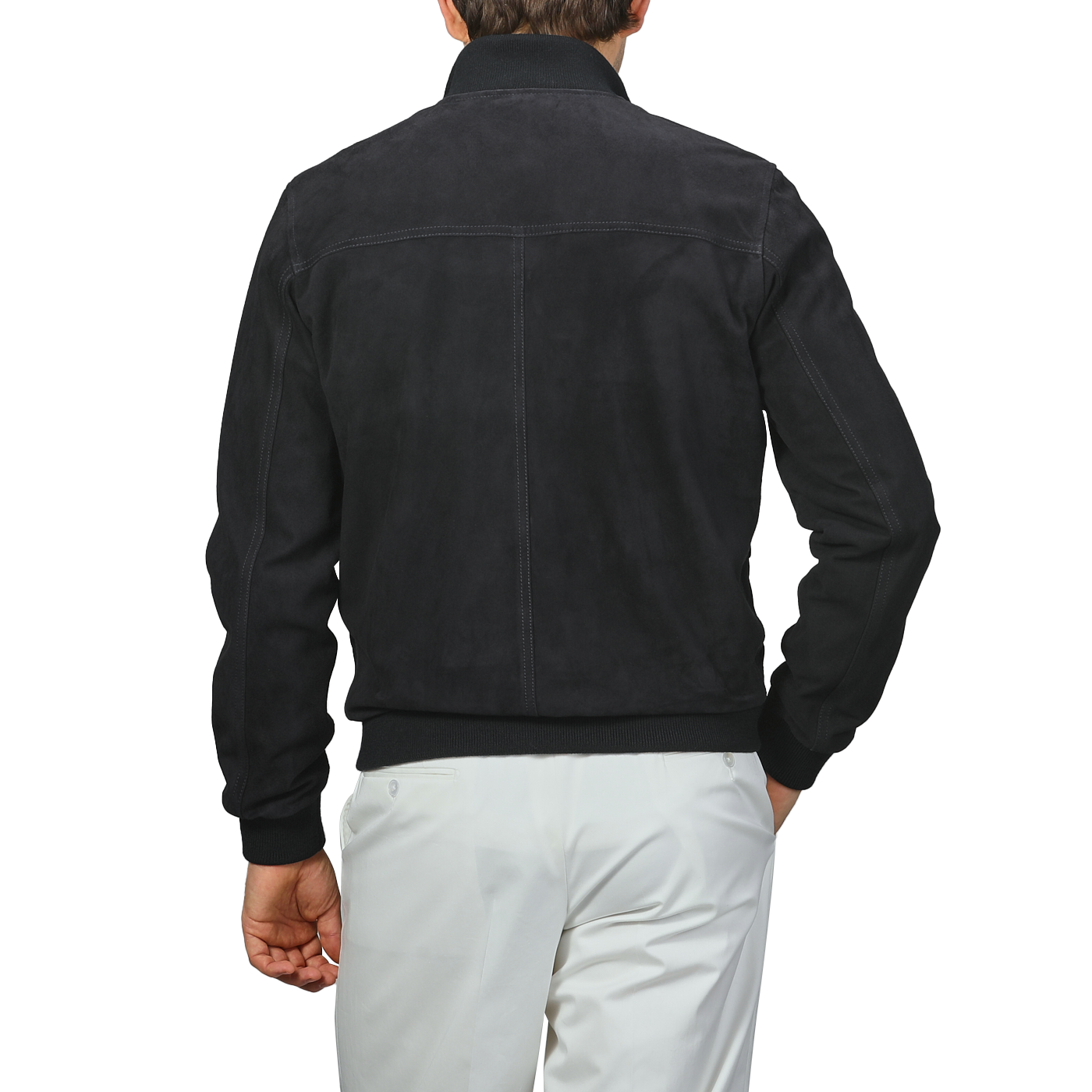 A man in a stylish Valstar Navy Blue Suede Leather Valstarino Jacket, paired with white pants, is seen from the back.