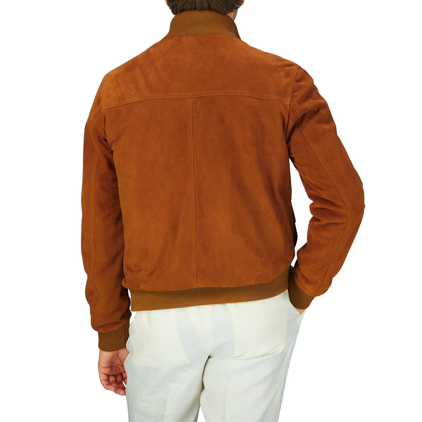 Man wearing an Italian Sandal Brown Suede Leather Valstarino jacket and white pants, seen from the back.