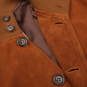 Close-up of a Sandal Brown Suede Leather Valstarino jacket by Valstar with buttons.