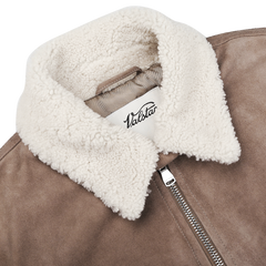 Valstar's Taupe Suede Leather Shearling Flight Jacket boasts a white shearling collar and a silver zipper, crafted from premium goat suede leather.