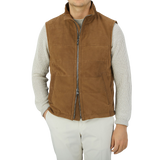 A man wearing a Werner Christ Tobacco Brown Suede Leather Alberto Gilet vest.