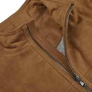A close up of a Tobacco Brown Suede Leather Alberto Gilet jacket with Primaloft technical padding from the Werner Christ brand name.