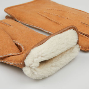 A pair of Cognac Beige Suede Leather Wool Lined Gloves by Werner Christ.