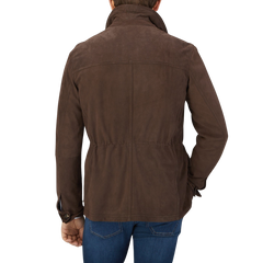 The back view of a man wearing a Dark Brown Suede Anton Leather Jacket, crafted with expertise by Werner Christ, a leather specialist.