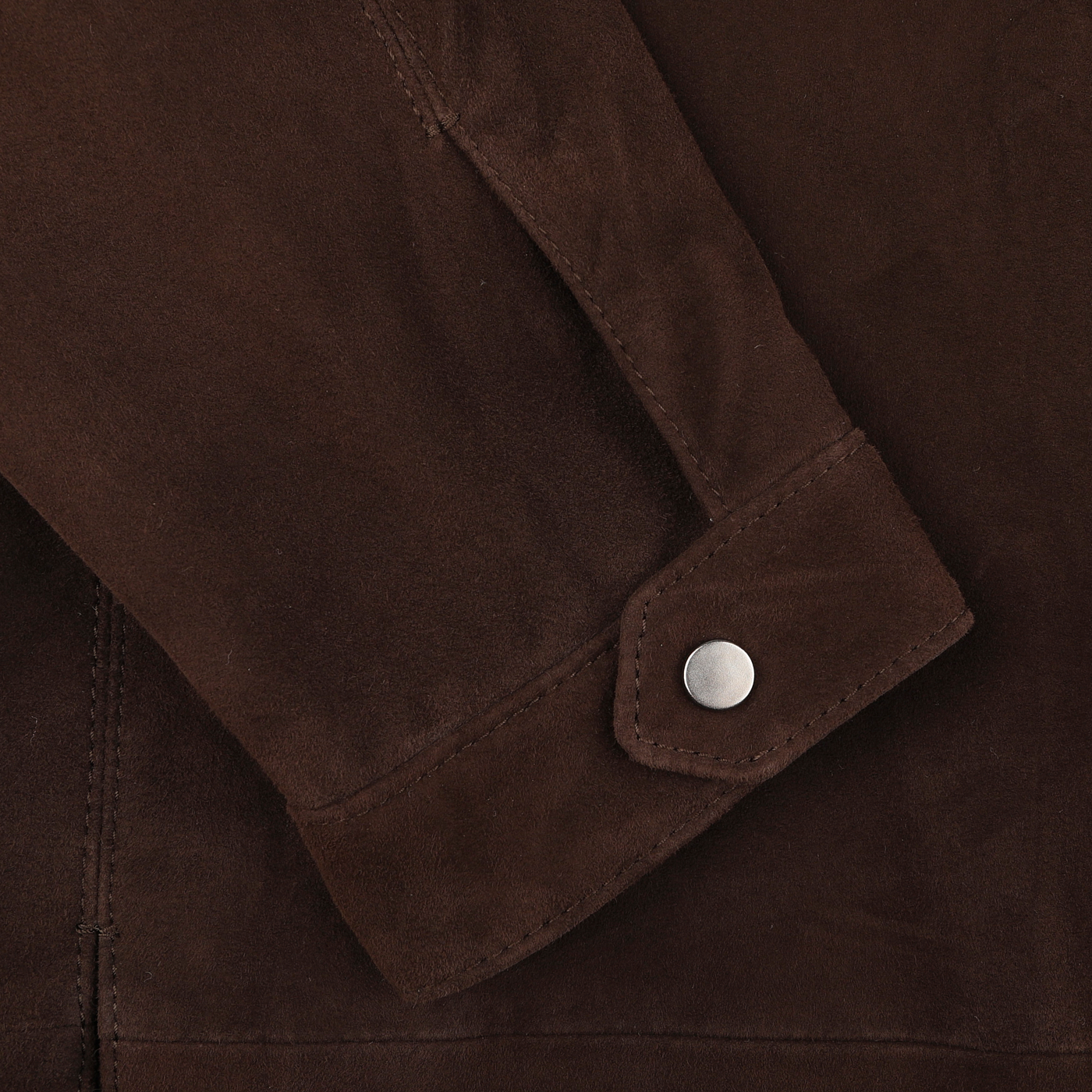 Close-up of the sleeve of a Dark Brown Suede Leather Amaro Shirt Jacket by Werner Christ, featuring a metal button on the cuff.