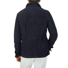 The back view of a man wearing a Werner Christ Navy Suede Anton Leather Jacket.