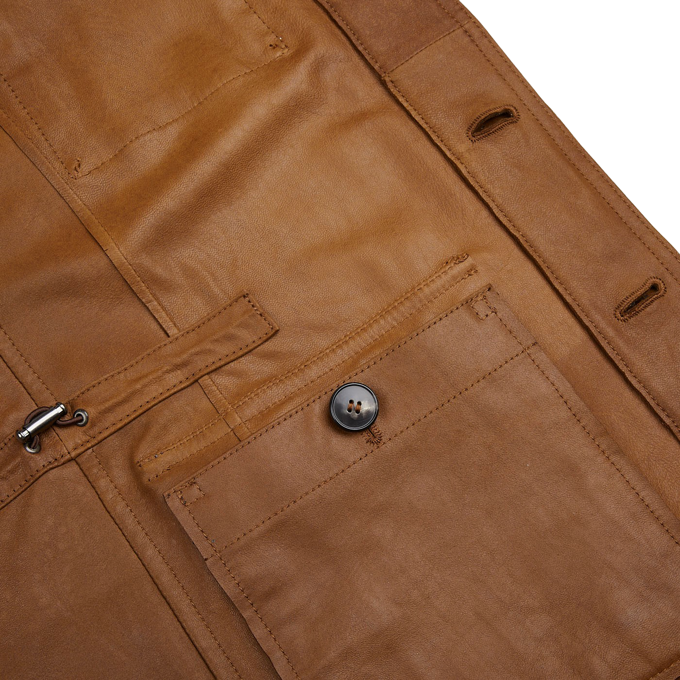 A close up of a Sandalwood Suede Leather Anton Jacket by Werner Christ, showcasing the intricate texture of the suede goatskin.