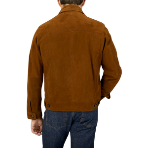 The back view of a man wearing a Sandalwood Suede Leather Joshi Jacket by Werner Christ.