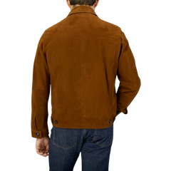 The back view of a man wearing a Sandalwood Suede Leather Joshi Jacket by Werner Christ.