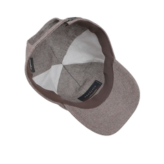 Beige herringbone-pattern baseball cap viewed from above, showcasing the fine Angelico wool interior lining and the brand label "Wigéns" on the inside.