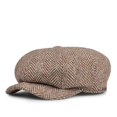 A beige herringbone newsboy cap with a short brim, crafted from luxurious wool tweed, by the brand Wigéns.