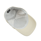 A Khaki Beige Nylon Microfibre Wigéns baseball cap on a white surface.