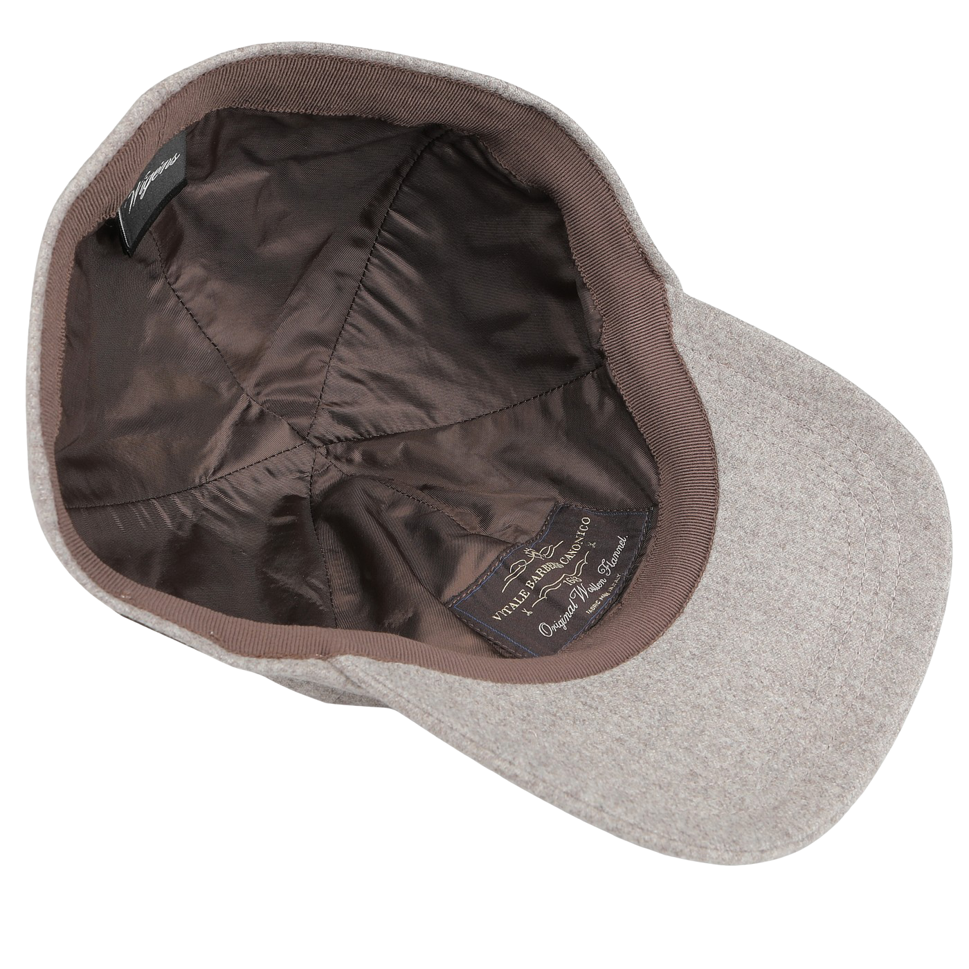 Beige wool baseball cap turned inside out, highlighting the elegance of its satin lining and label. Crafted from pure wool flannel by Vitale Barberis Canonico for Wigéns, this cap is as stylish on the inside as it is on the outside.