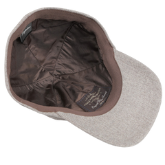 Beige wool baseball cap turned inside out, highlighting the elegance of its satin lining and label. Crafted from pure wool flannel by Vitale Barberis Canonico for Wigéns, this cap is as stylish on the inside as it is on the outside.