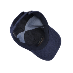 Top-down view of the interior of the Blue Herringbone Angelico Wool Baseball Cap by Wigéns, featuring a fabric-lined brim, visible stitching, and an adjustable strap.