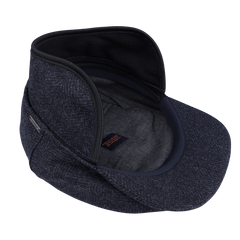 A stylish gray cap, unzipped and crafted from pure wool, featuring an ample brim and showcasing an interior compartment equipped with storm system protection; it’s the Blue Herringbone Wool Ivy Contemporary Cap by Wigéns.