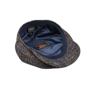 A Wigéns Blue Melange Wool Ivy Contemporary Cap with a blue pocket, made from a wool blend.