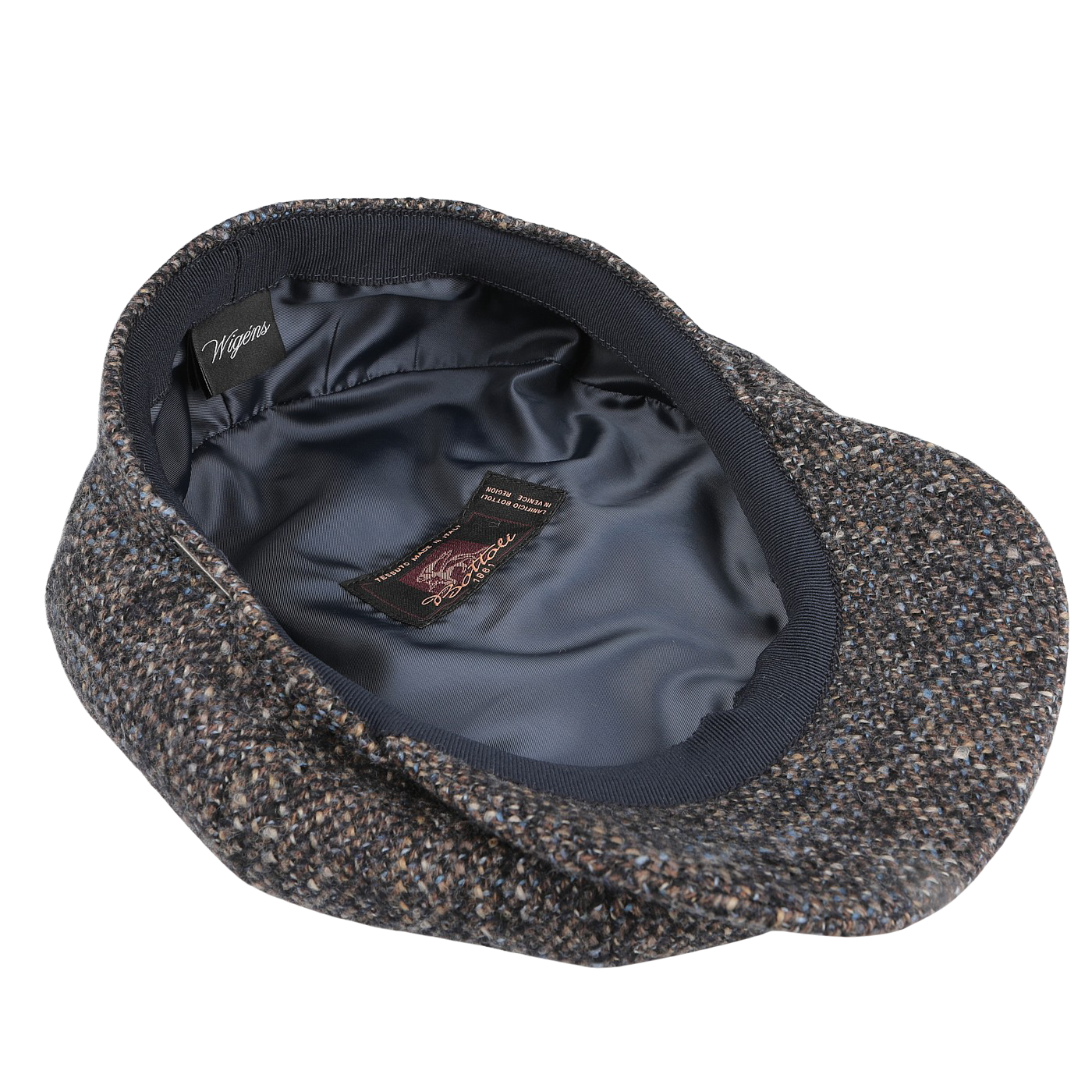 A Blue Melange Wool Ivy Contemporary Cap by Wigéns, crafted from a contemporary wool blend, features a dark satin lining and brand labels on the interior.