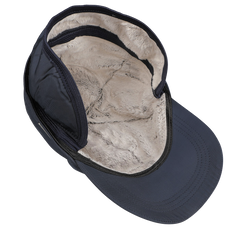 A Wigéns Blue Nylon Fleece Lined Baseball Cap, constructed from technical nylon, showcases a faux fur lining and snug ear coverage, guaranteeing warmth on cold days.